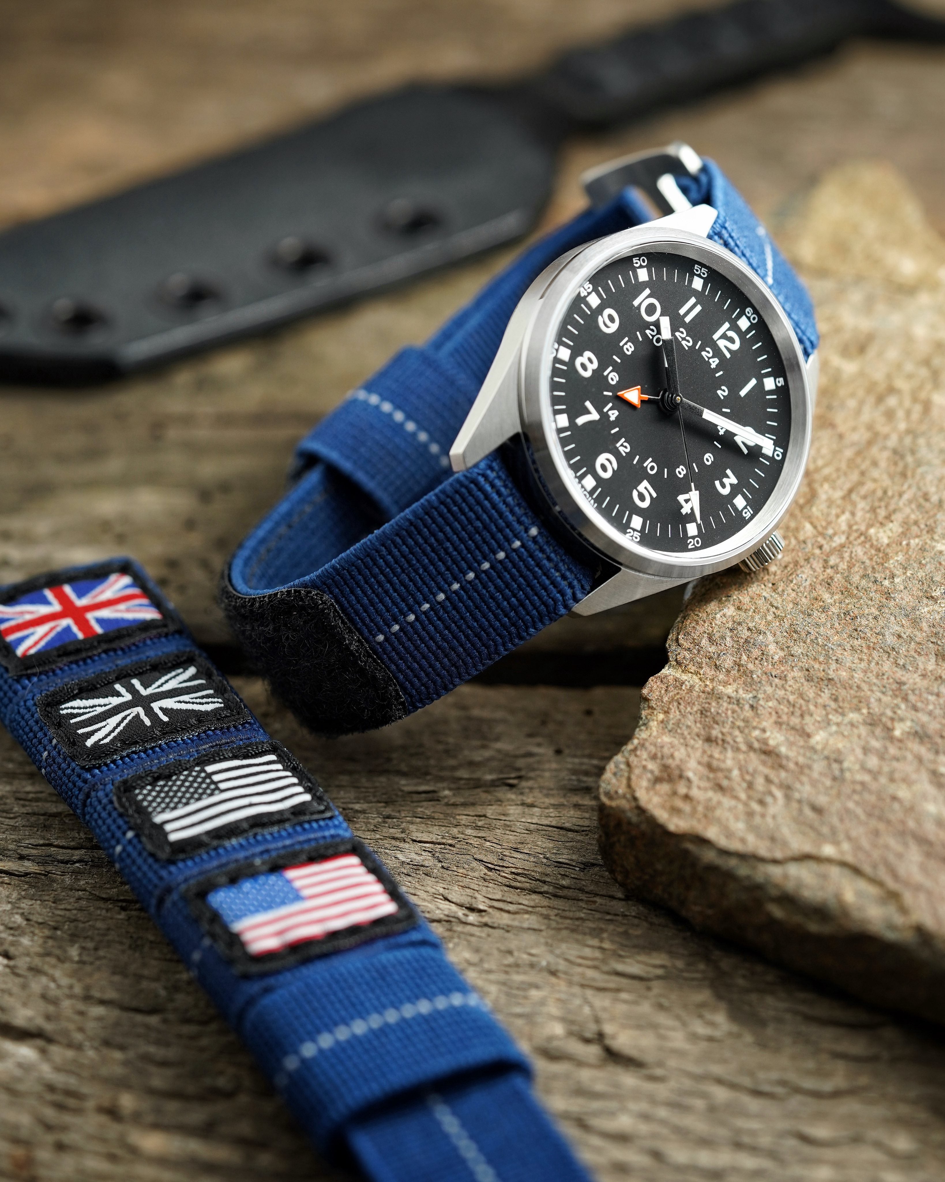 Blue elastic flex watch strap with military flags on field watch